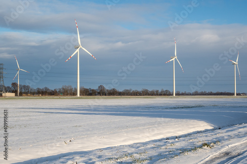 Wind farm for electric power production. Winter landscape in northern Poland. Europe