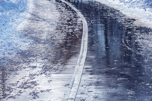 Wet asphalt road surface at winter morning. © serjiob74