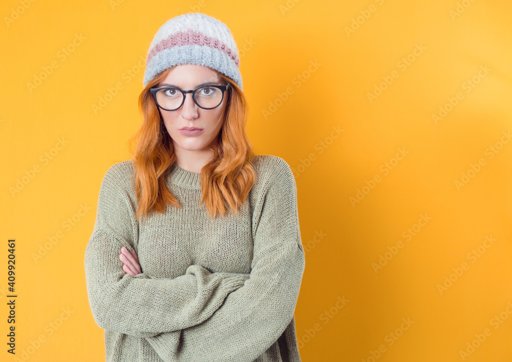 Irritated young woman holding her arms crossed, having skeptic, angry and annoyed face, isolated on white background