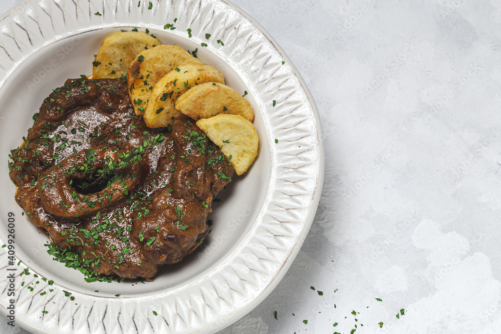 Homemade stew of osso buco meat with aromatic herb sauce Homemade stew of osso buco meat with aromatic herb sauce