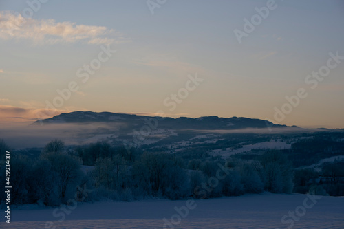 Toten  sen Hills seen from the rural lowlands of Toten  Norway  in winter.
