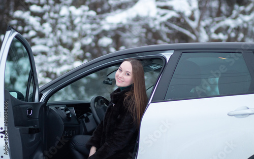 A woman driving a car in winter. Winter car driving by a woman © yarm_sasha