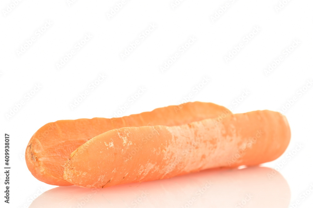 One ripe organic, unpeeled carrot, cut in half, close-up, isolated on white. One ripe organic, unpeeled carrot, cut in half, close-up, isolated on white.