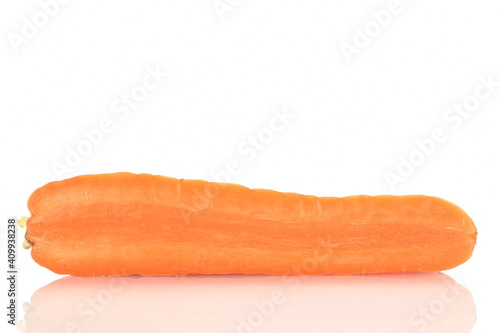 One half of a ripe organic, unpeeled carrot, close-up, isolated on white.