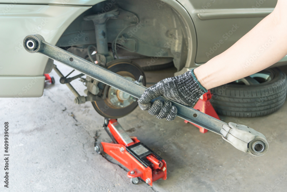 Rear trailing arms of car suspension, Car maintenance service.