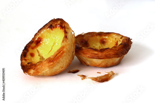 Portuguese custard pastry called a pasteis de nata isolated on white background photo