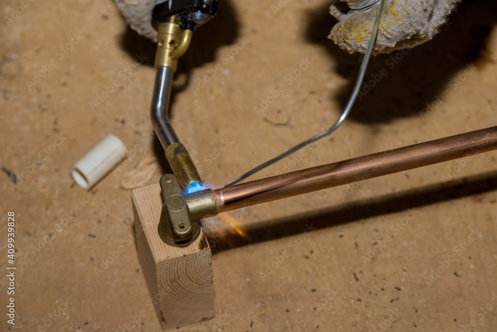 Soldering brass fitting on copper pipe with torch of welding Stock Photo Adobe Stock