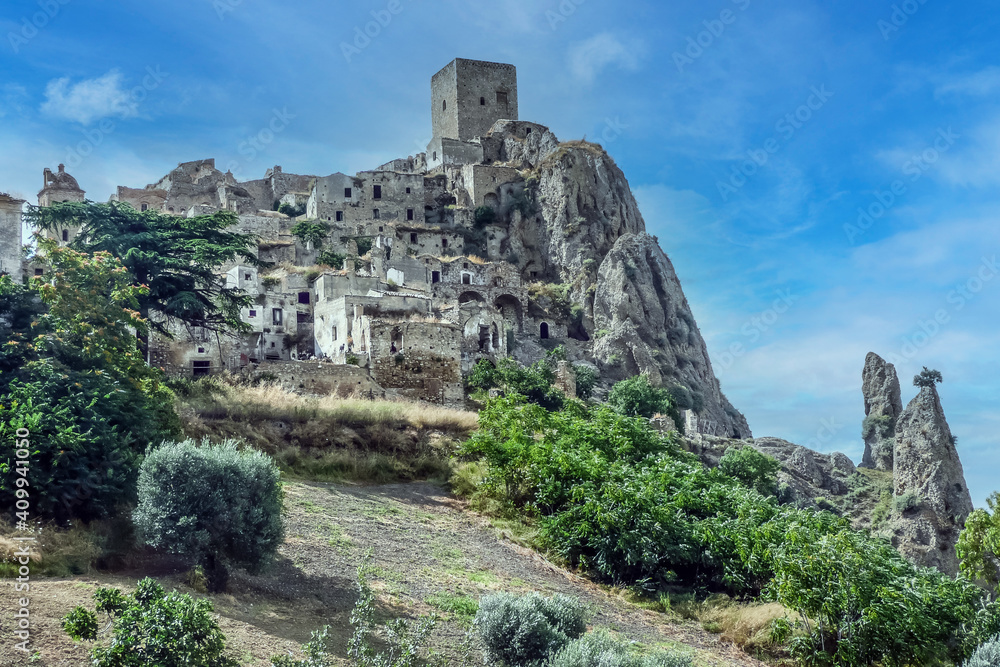 landscape of the ghost town of Craco, with abandoned houses in ruins due to a landslide