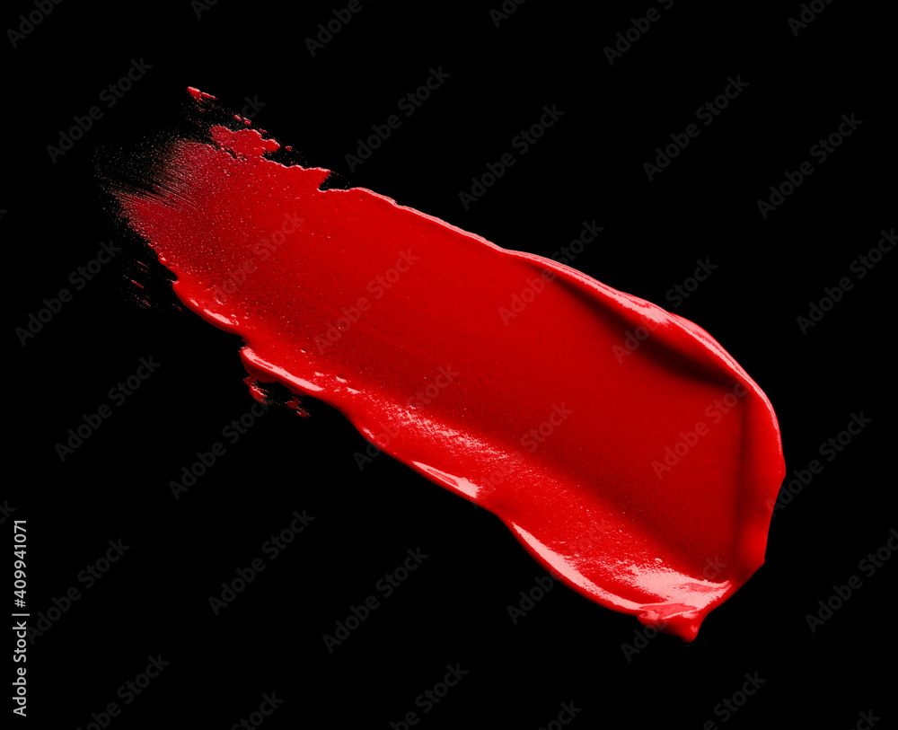 Red lipstick stroke isolated on black background