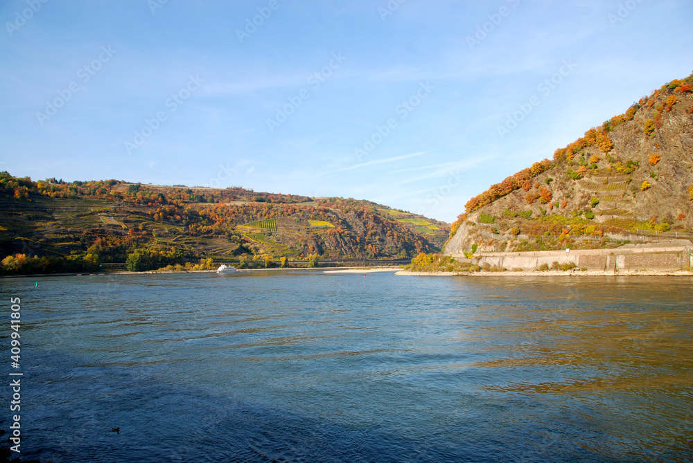 bend of Rhine river with vessel in fall