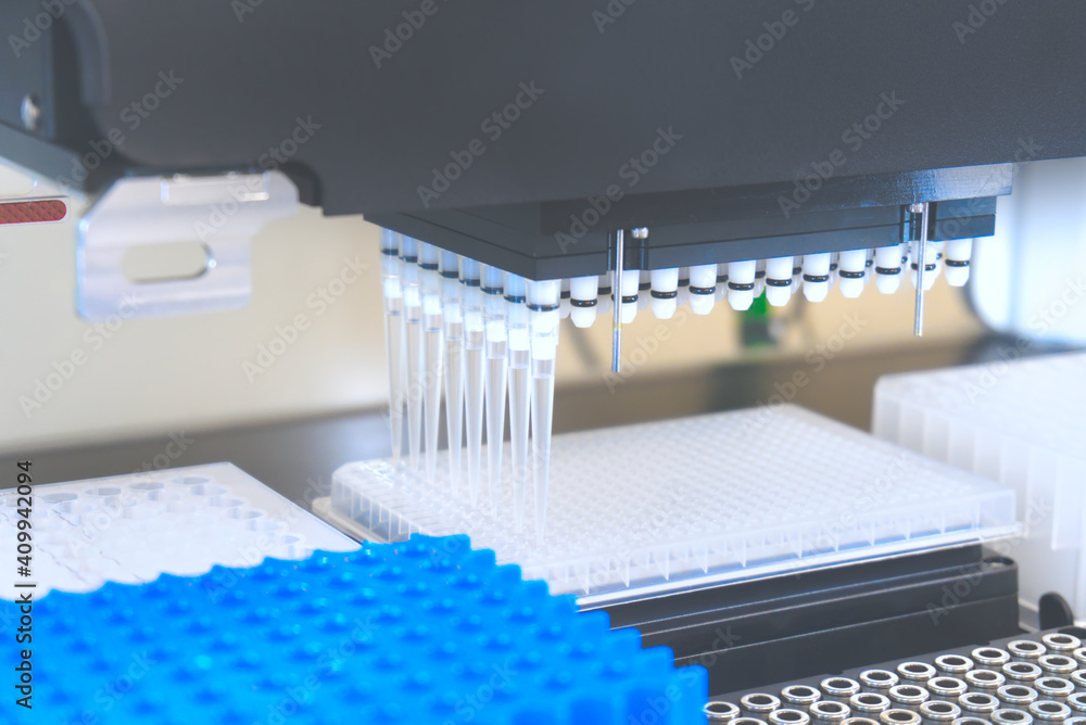 Automation in the clinical laboratory. Pipetting robot laboratory. Medicine robotics. Research and science background
