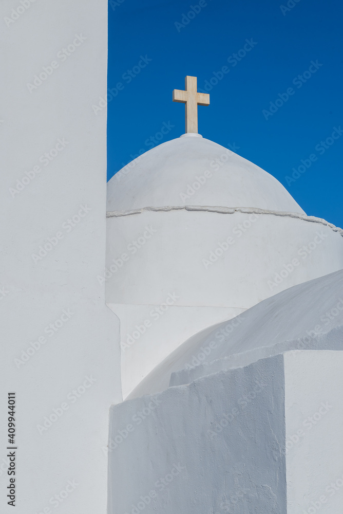 Cross on top of a church with minimal aegean architecture. Sifnos. Cyclades, Greece. Cross on top of a church with minimal aegean architecture. Sifnos. Cyclades, Greece.
