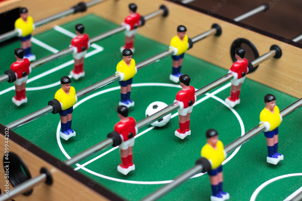 Close up of a table soccer game. Table football is a toy for children Close up of a table soccer game. Table football is a toy for children