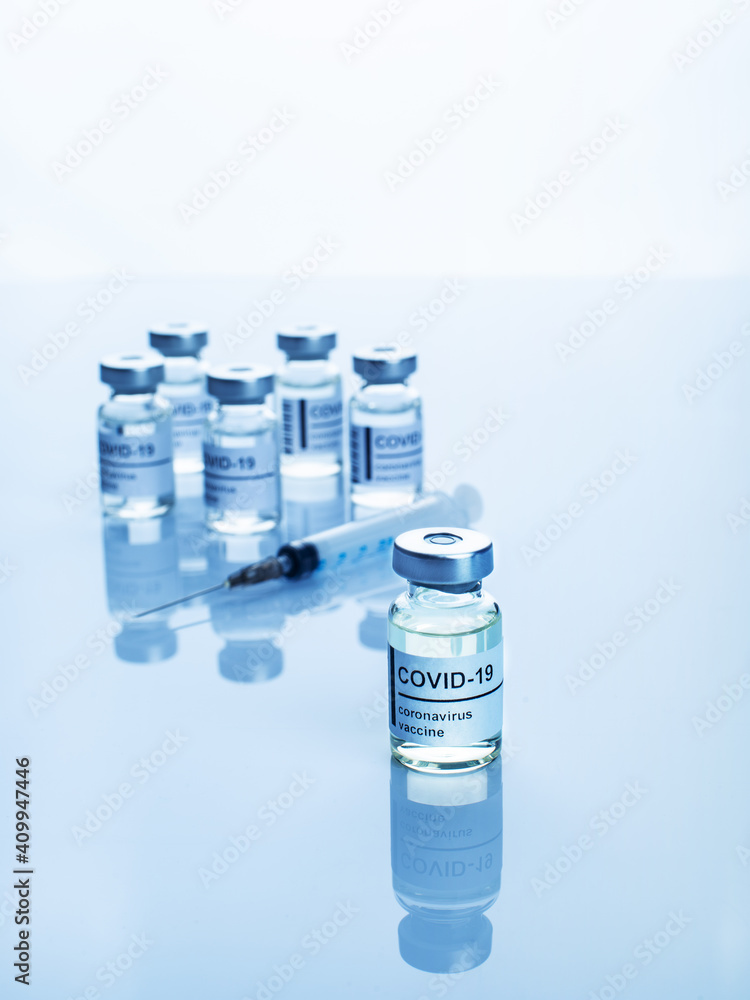 Glass sealed vials with coronavirus vaccine text on label Glass sealed vials with coronavirus vaccine text on label