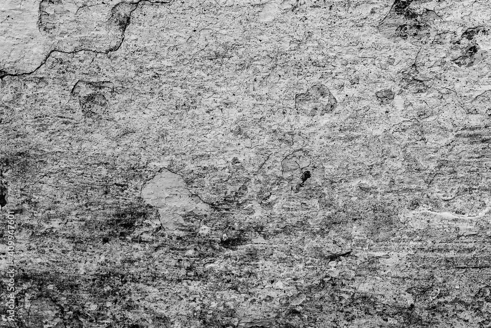 Texture of a concrete wall with cracks and scratches which can be used as a background Texture of a concrete wall with cracks and scratches which can be used as a background