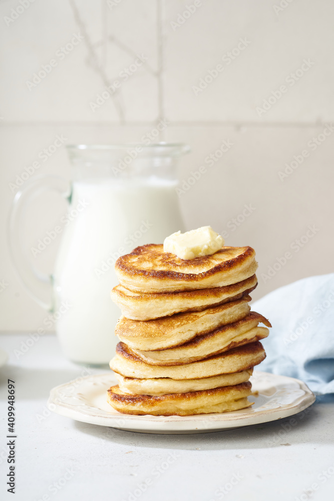 Fluffy breakfast pancakes with maple syrup and berries Fluffy breakfast pancakes with maple syrup and berries