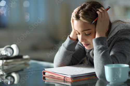 Concentrated student studying memorizing notes photo