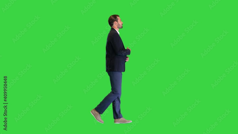 Young handsome business man walking and talking to himself on a Green Screen, Chroma Key. Young handsome business man walking and talking to himself on a Green Screen, Chroma Key.