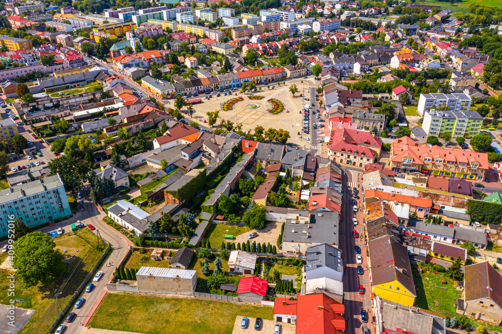 Top aerial panoramic view of Lowicz old town historical city centre with Rynek Market Square, Old Town Hall, New City Hall, colorful buildings with multicolored facade and tiled roofs, Poland Top aerial panoramic view of Lowicz old town historical city centre with Rynek Market Square, Old Town Hall, New City Hall, colorful buildings with multicolored facade and tiled roofs, Poland