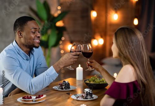 Romantic Dinner At Home. Loving Interracial Couple Dining In Elegant Domestic Atmosphere