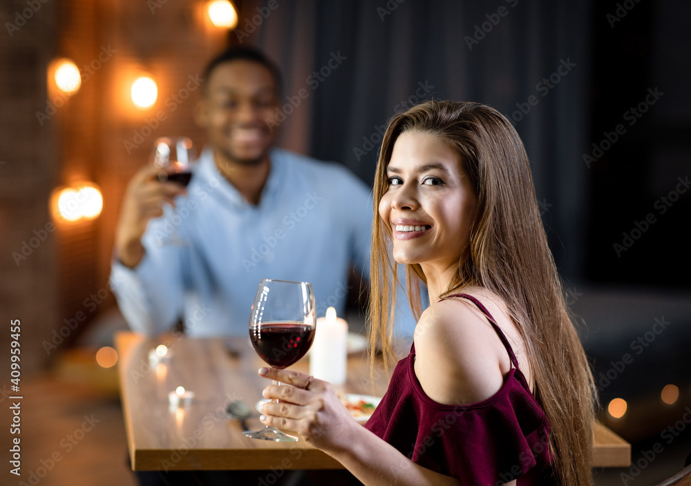 Valentine's Day Celebration. Interracial Couple In Love Having Romantic Dinner In Restaurant Valentine's Day Celebration. Interracial Couple In Love Having Romantic Dinner In Restaurant