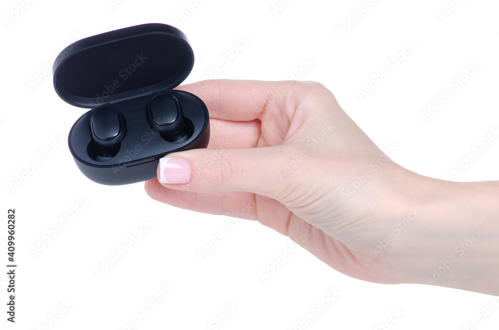 Black wireless headphones in hand on white background isolation Black wireless headphones in hand on white background isolation
