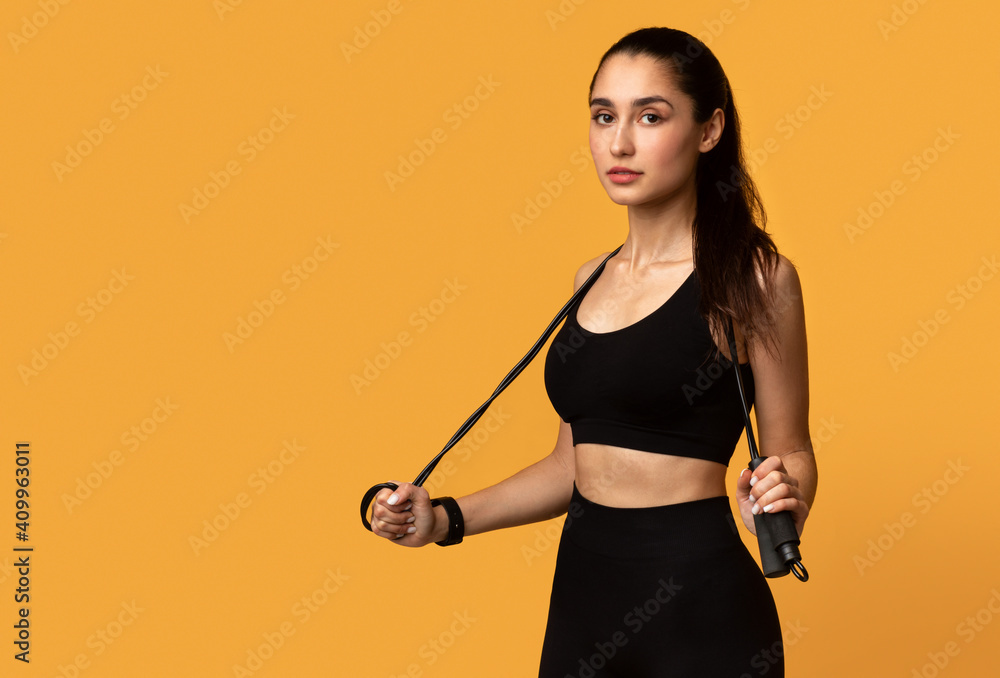 Young Woman Posing With Jumping Rope At Studio Young Woman Posing With Jumping Rope At Studio