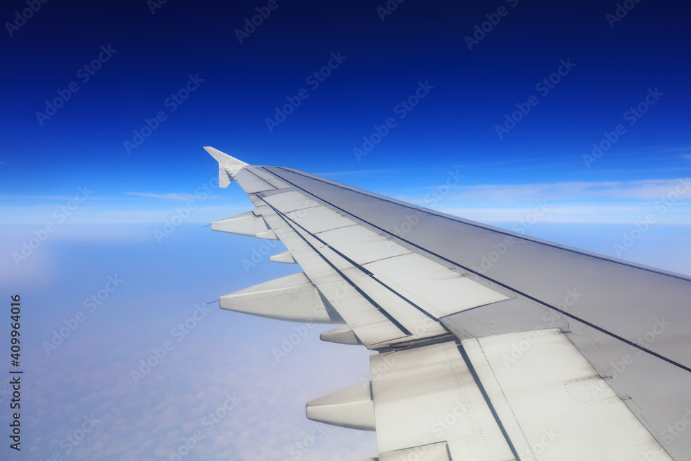 Wings of large passenger aircraft, flying at high altitude, South China Wings of large passenger aircraft, flying at high altitude, South China