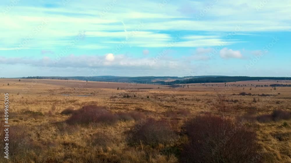 Aerial forward shot marshland valley clouds blue sky colorful landscape Aerial forward shot marshland valley clouds blue sky colorful landscape