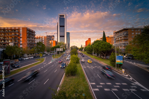 Magnificent view of asphalt road with traffic cars at evening in Madrid
