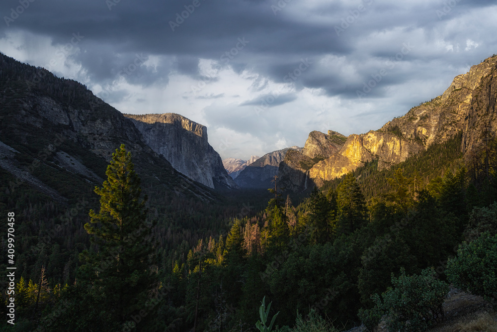 Magnificent scenery of mountain ridge lit by sunset light in evening in Yosemite National Park Magnificent scenery of mountain ridge lit by sunset light in evening in Yosemite National Park