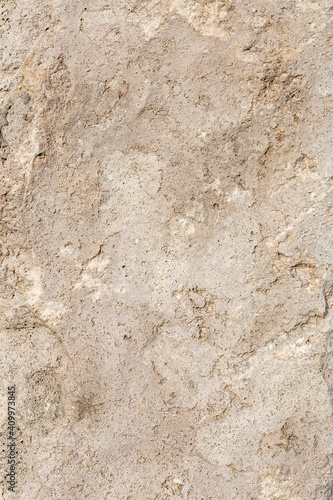 Empty  rough  uneven texture of a brown concrete wall close up with copy space