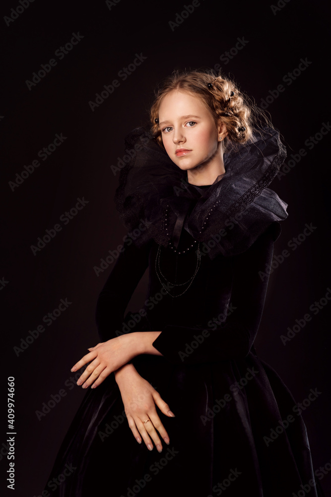 Beautiful little red-haired girl in a medieval queen costume. Black on black. Stylization.