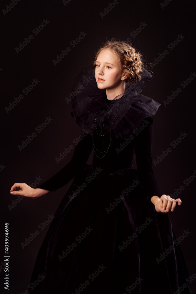 Beautiful little red-haired girl in a medieval queen costume. Black on black. Stylization.