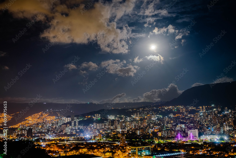 Beautiful night with a full moon above the city of Medellin, Antioquia, Colombia