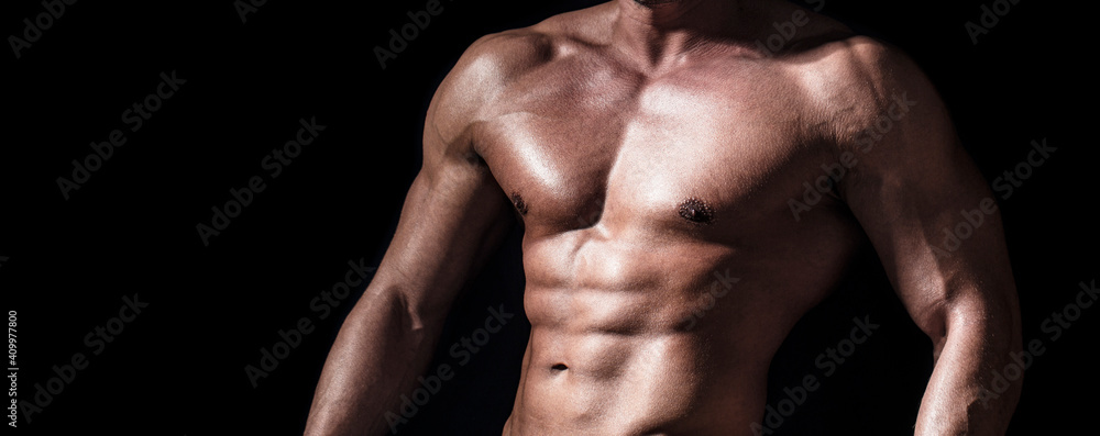 Sexy torso. Handsome big muscles man posing at studio. Muscular sexy man. Handsome sexual strong man with muscular body. Torso with six pack and ab muscle. Abs and biceps. Strong brutal guy