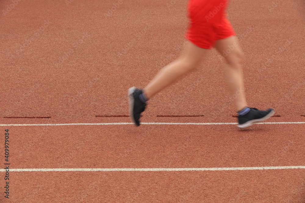 Long distance runners are running on the track Long distance runners are running on the track