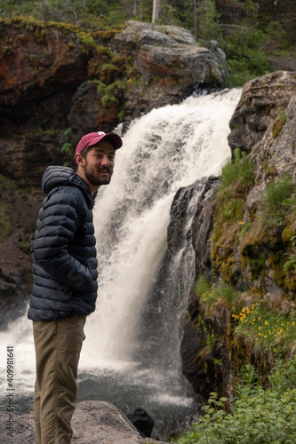 Hiker with Waterfall in Yellowstone National Park © Colleen