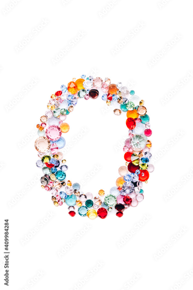 Letter O made from beautiful glass bright gems or crystals on isolated white background