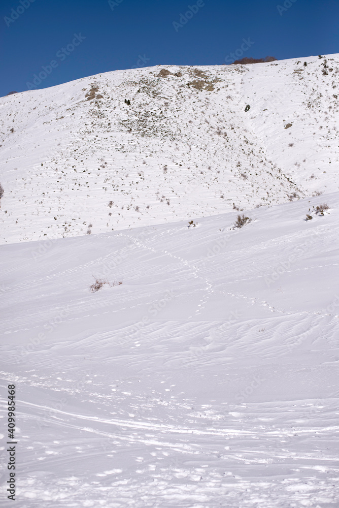 Winter landscape of mountain range located on slope covered with white snow in Montseny Massif in Spain Winter landscape of mountain range located on slope covered with white snow in Montseny Massif in Spain