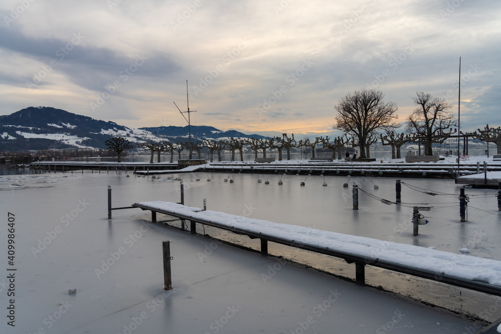 Sunset over the harbor of the charming old city of Rapperswil, St. Gallen, Switzerland