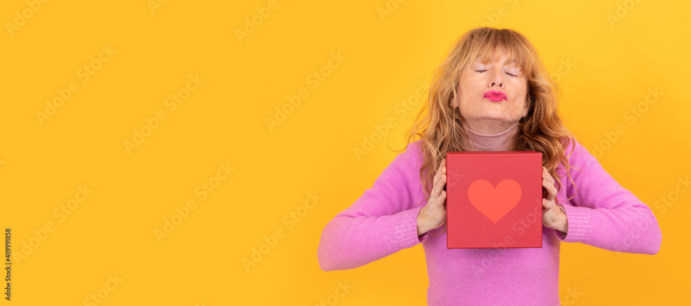 woman kissing with gift box with heart, valentine days woman kissing with gift box with heart, valentine days