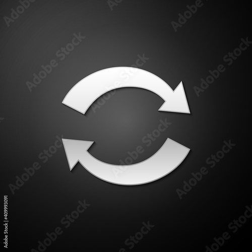 Silver Refresh icon isolated on black background. Reload symbol. Rotation arrows in a circle sign. Long shadow style. Vector.