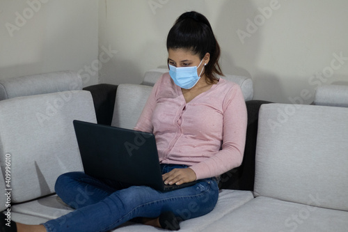Young woman studying from home for covid 19
