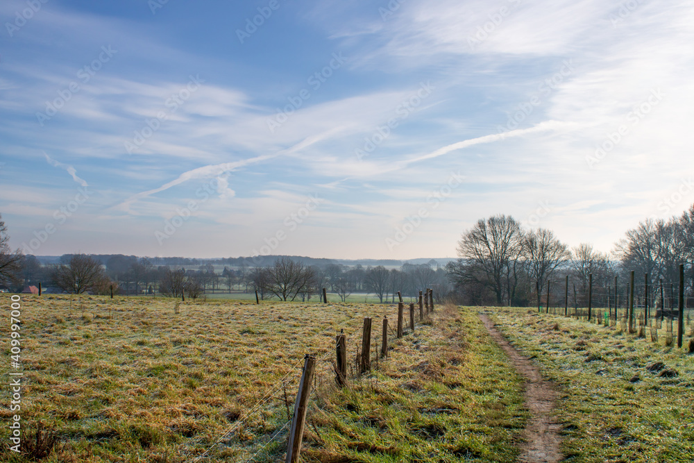 Walking trail in Dutch town of Markelo, Twente, at a frosty winter morning Walking trail in Dutch town of Markelo, Twente, at a frosty winter morning