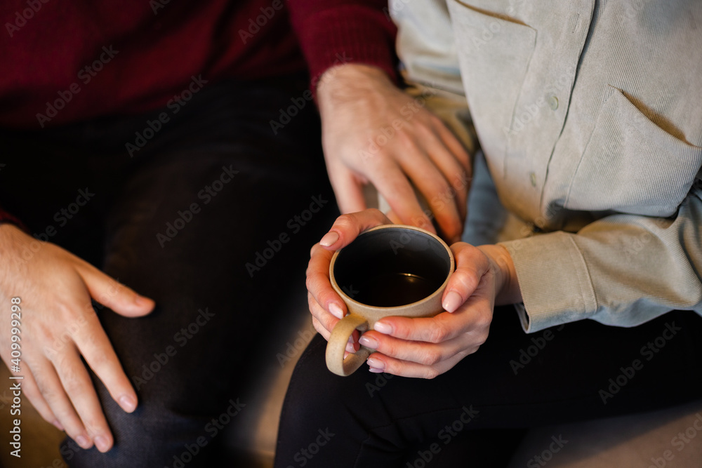 People, communication and dating concept - young happy romantic loving couple drinking tea and coffee or tea at cafe. People, communication and dating concept - young happy romantic loving couple drinking tea and coffee or tea at cafe.