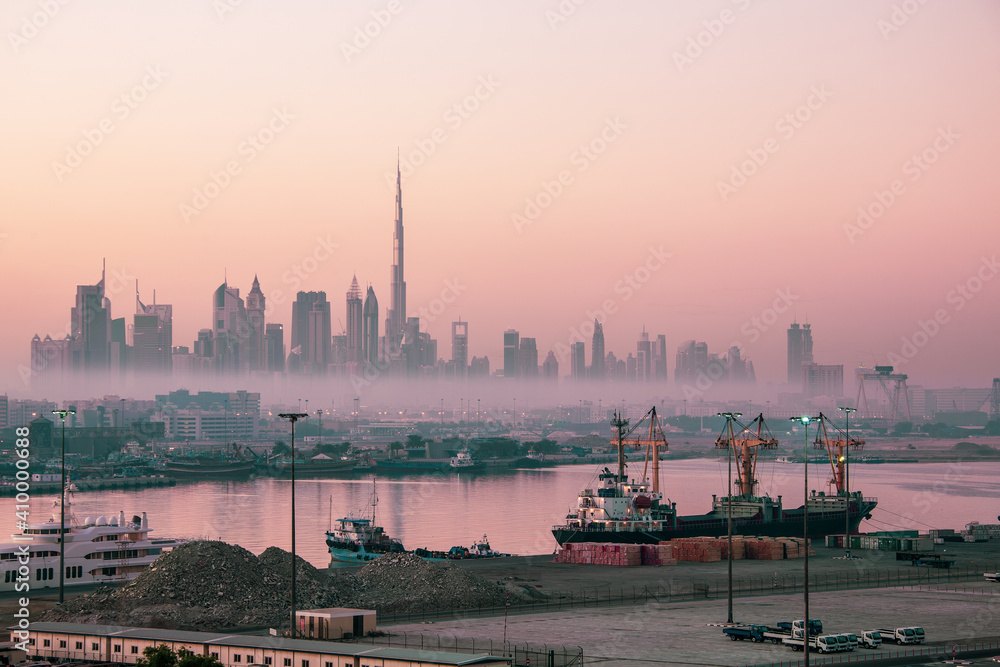 Fototapeta premium Dubai city skyline at morning fog