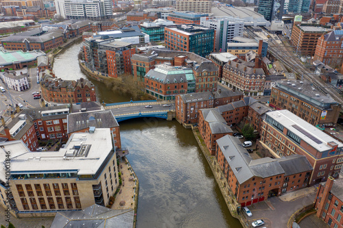 Aerial photo of the area in the Leeds City Centre known as Brewery Wharf on a beautiful sunny summers day showing buildings by the Leeds and Liverpool canal with building on the canal bank