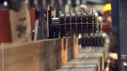 Production process in a furniture factory, woodworking machine mechanism close up. Workflow in a furniture factory. Woodworking factory