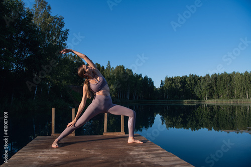 Calm young woman taking deep breath of fresh air relaxing meditating enjoying peace, serene tranquil girl doing yoga exercise feel no stress free relief